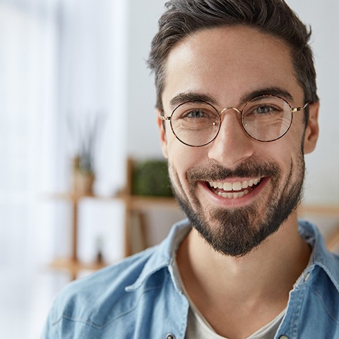 Smiling man with glasses and dental bonding in Brecksville 