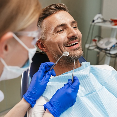 Man receiving emergency dentistry treatment