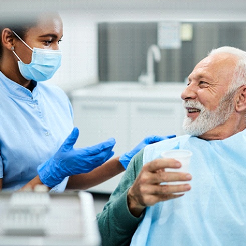 IOlder patient speaking with an implant dentist in Brecksville