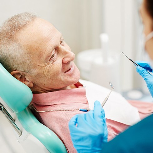 Man speaking with an implant dentist in Brecksville