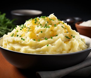 a bowl of soft mashed potatoes