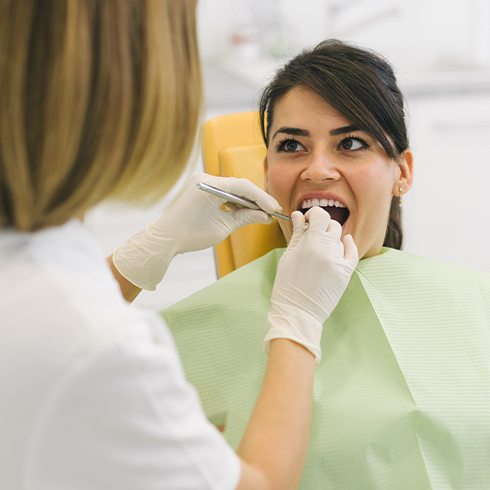 Woman receiving root canal therpay